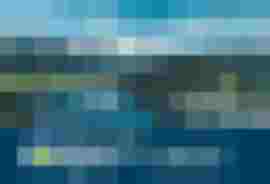 Panoramablick auf Zell am See und Kaprun mit Zeller See und umliegenden Bergen.